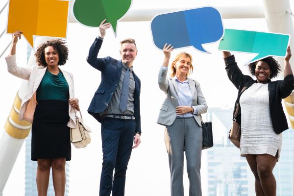 people holding chat bubbles